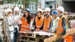 Group of skilled tradespeople talking on a job site